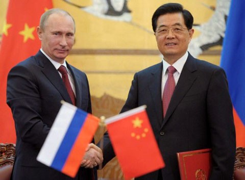 Russia, China pledge to boost bilateral ties - ảnh 1
